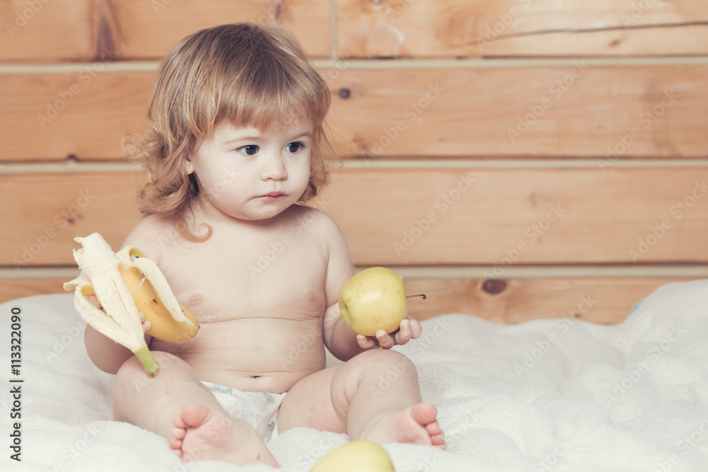 Fototapeta premium Boy with banana and apples