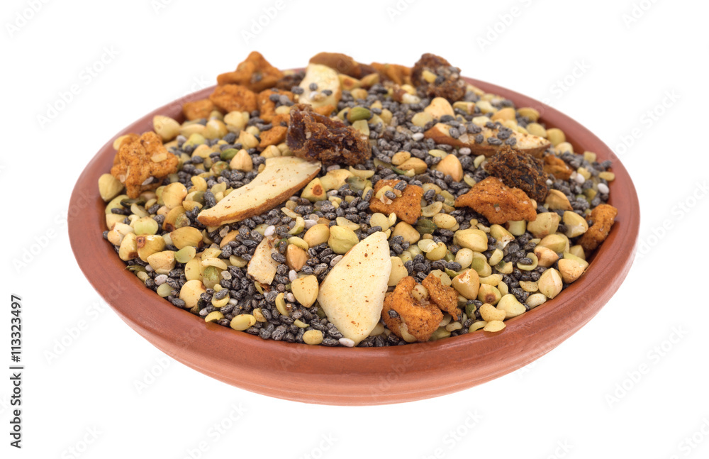 Bowl of chia seeds nuts and fruit breakfast cereal isolated on a white background side view. Bowl of chia seeds nuts and fruit breakfast cereal isolated on a white background side view.