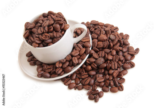 Coffee beans and cup on white background