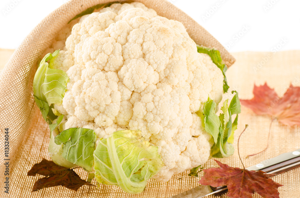 Cauliflower with burlap sack on white Cauliflower with burlap sack on white