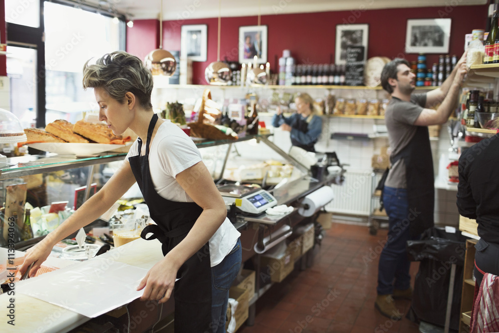 People working in grocery store 