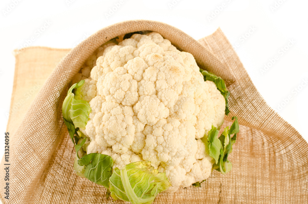Cauliflower with burlap sack on white Cauliflower with burlap sack on white