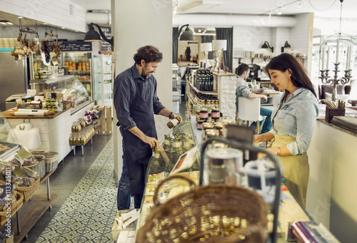 People working in delicatessen 