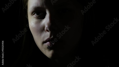 Sad teen girl, fear in her eyes. 4K UHD