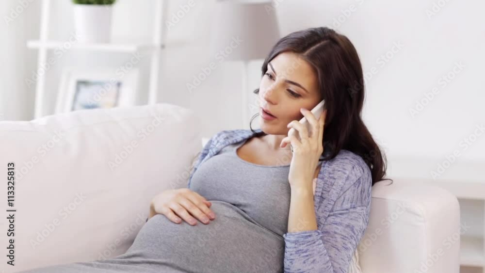 happy pregnant woman calling on smartphone at home happy pregnant woman calling on smartphone at home