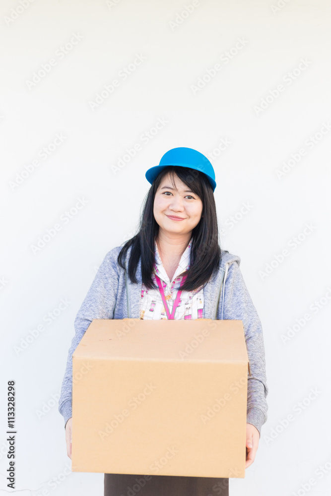 Smiling asian woman in uniform clothes with parcel box on white