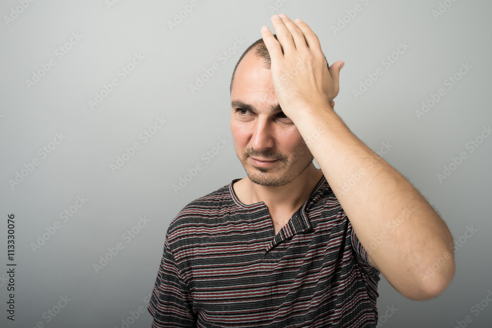 man holding his head man holding his head