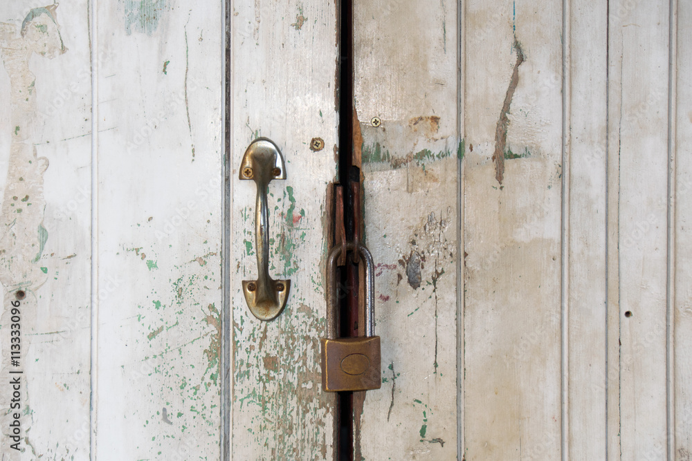 Close up Old white door and master key lock