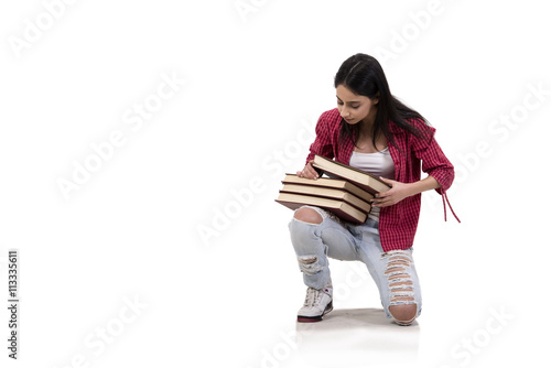 Female young student with books isolated on white