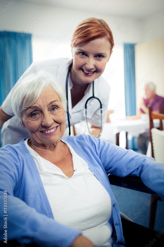 Fototapeta premium Portrait of nurse with a senior woman 