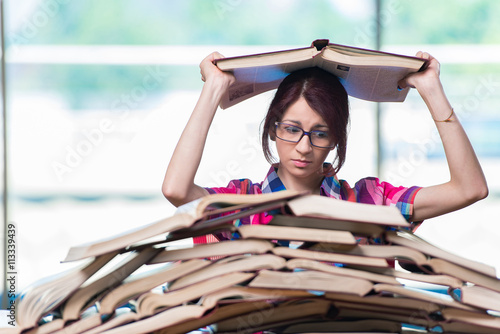 Young female student preparing for exams photo