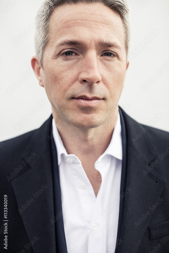 Portrait of serious businessman against clear sky Portrait of serious businessman against clear sky