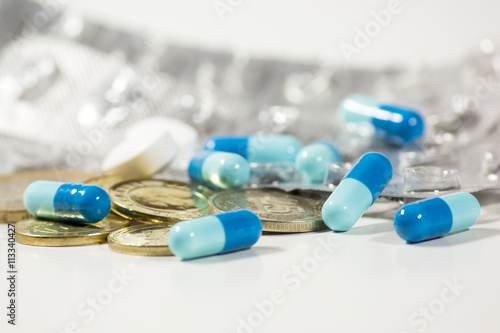 medicine pills and coins