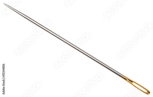steel sewing needle with golden needle's eye photo