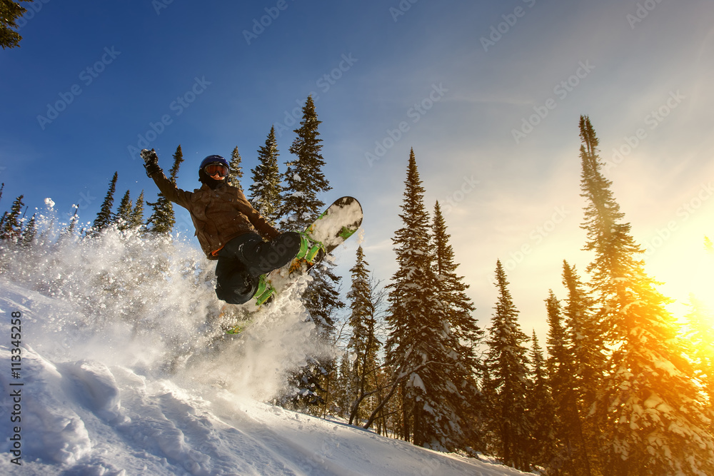 Fotografering, Billede Jumping snowboarder on snowboard in mountains in ski  resort på Europosters.dk