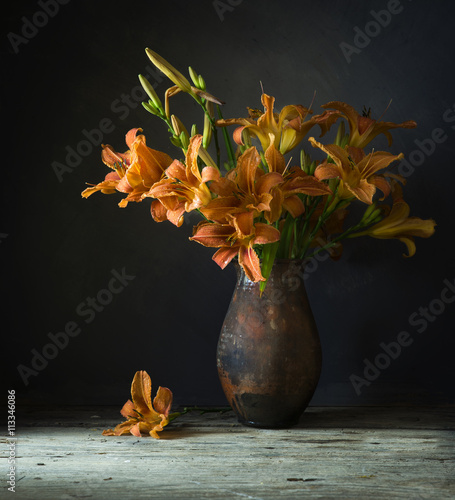 Still life with beautiful orange lilies