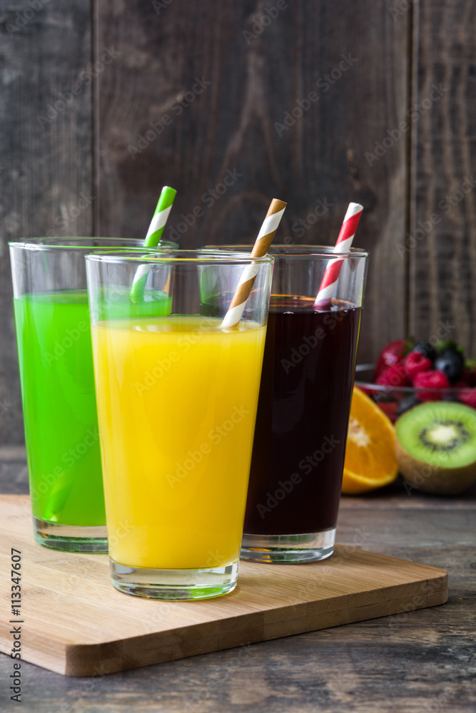 Fototapeta premium Fresh fruit smoothies on a rustic wooden background