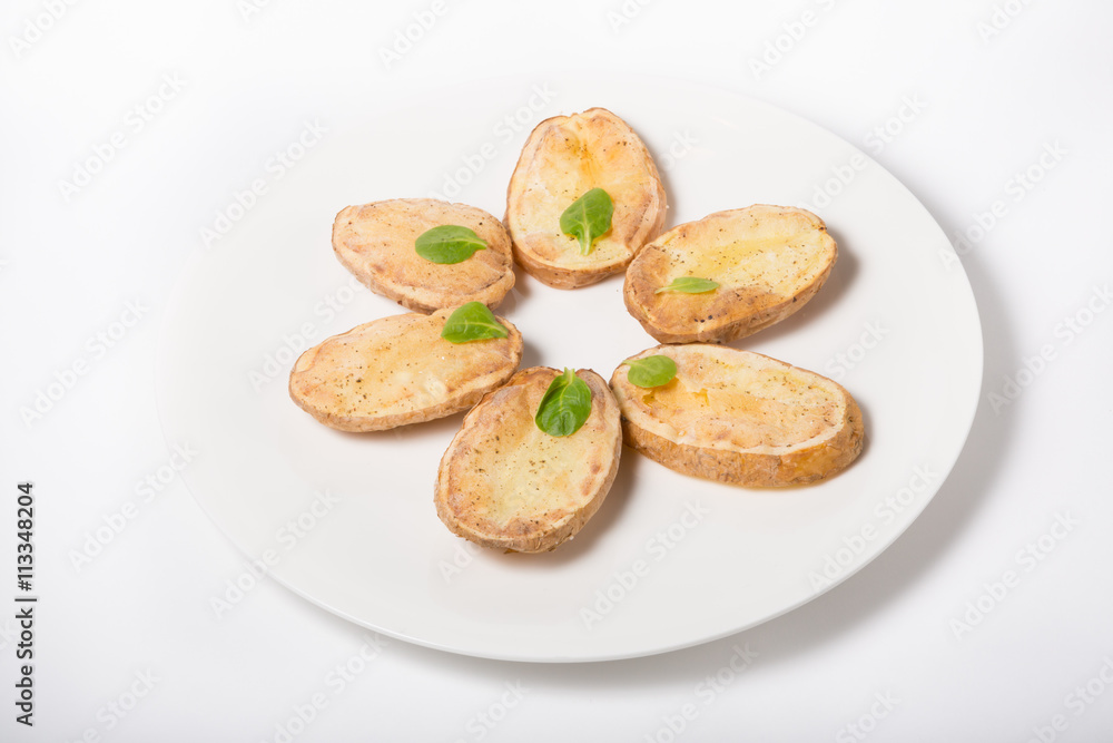 Baked potato sliced on a plate Baked potato sliced on a plate