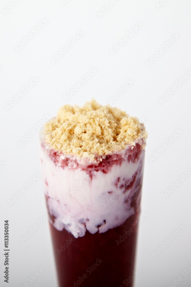 Cocktail with ice-cream, raspberry and cookie crumbs on the white background Cocktail with ice-cream, raspberry and cookie crumbs on the white background