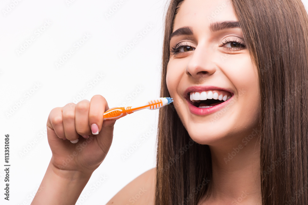 Closeup portrait of attractive female clean teeth in the bathroom, dental clinic, dentistry health care, healthy lifestyle, tooth whitening concept Closeup portrait of attractive female clean teeth in the bathroom, dental clinic, dentistry health care, healthy lifestyle, tooth whitening concept