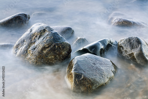 Wet stones in hot spring photo