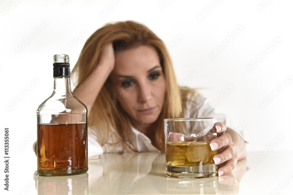 caucasian blond wasted and depressed alcoholic woman drinking scotch whiskey glass messy drunk caucasian blond wasted and depressed alcoholic woman drinking scotch whiskey glass messy drunk