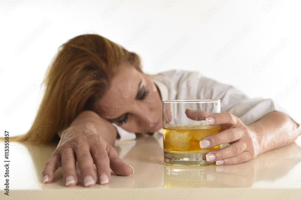 caucasian blond wasted and depressed alcoholic woman drinking scotch whiskey glass messy drunk caucasian blond wasted and depressed alcoholic woman drinking scotch whiskey glass messy drunk