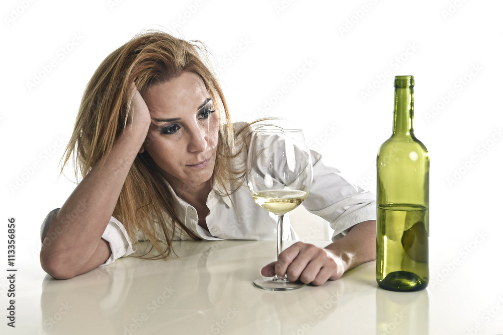 blond wasted and depressed alcoholic drunk woman drinking white wine glass desperate sad blond wasted and depressed alcoholic drunk woman drinking white wine glass desperate sad