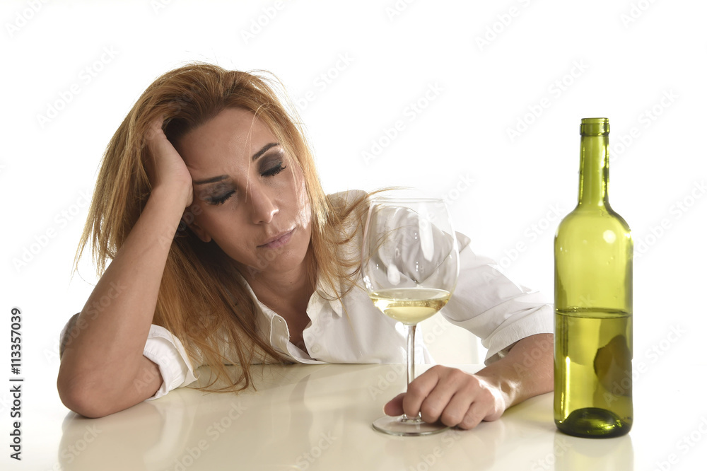 blond wasted and depressed alcoholic drunk woman drinking white wine glass desperate sad blond wasted and depressed alcoholic drunk woman drinking white wine glass desperate sad