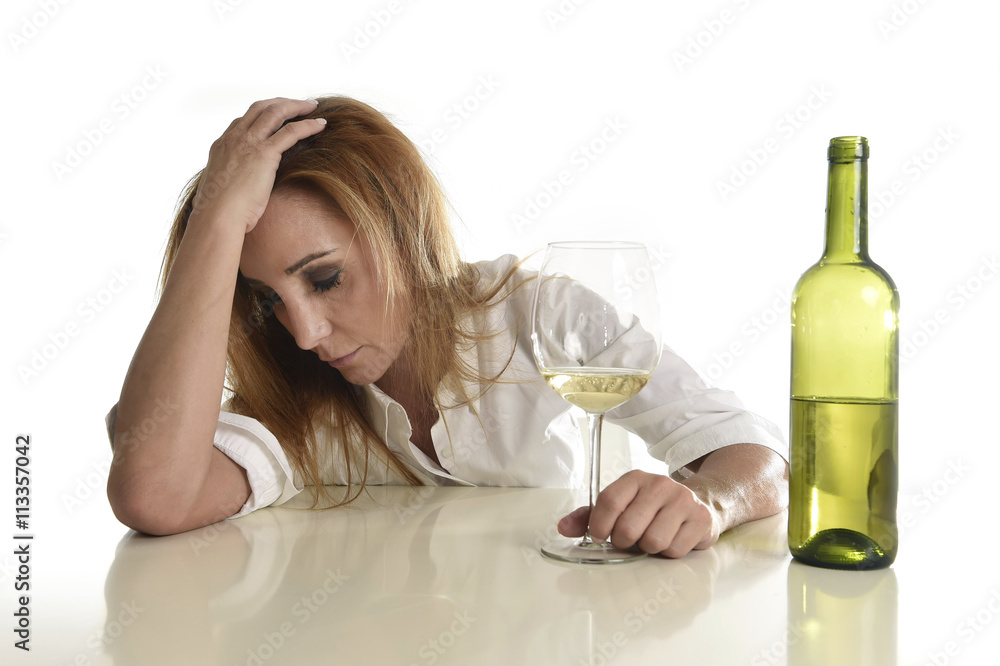blond wasted and depressed alcoholic drunk woman drinking white wine glass desperate sad blond wasted and depressed alcoholic drunk woman drinking white wine glass desperate sad