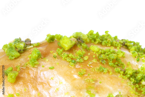 Delicious Turkish baklava with green pistachio nuts. Macro image photo