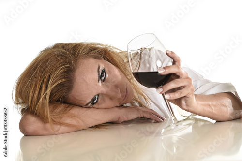 caucasian blond wasted depressed alcoholic woman drinking red wine glass alcohol addiction