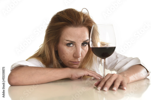 caucasian blond wasted depressed alcoholic woman drinking red wine glass alcohol addiction