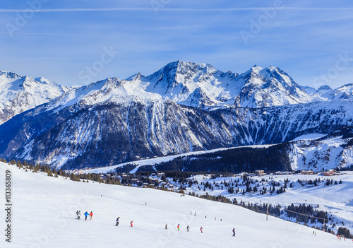 View of snow covered Courchevel slope in French Alps