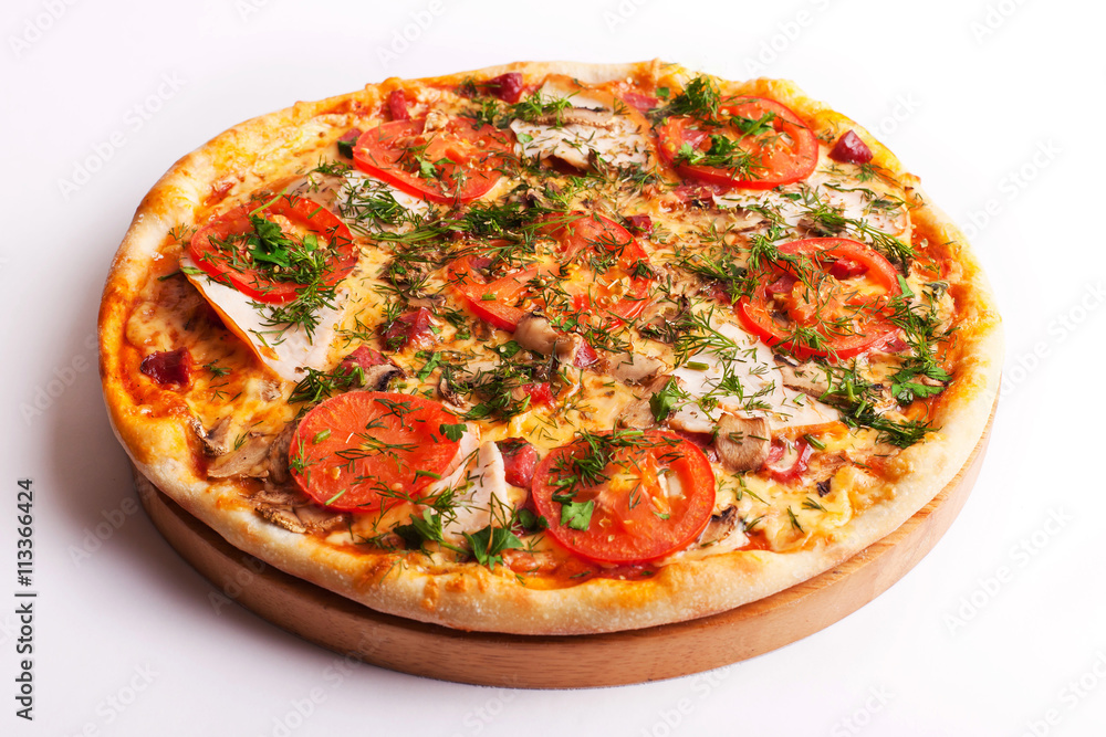 Pizza with ham, tomatoes and mushrooms isolated on white Pizza with ham, tomatoes and mushrooms isolated on white