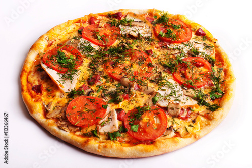 Pizza with ham  tomatoes and mushrooms isolated on white