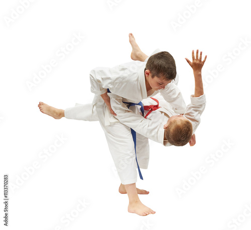 Children on a white background are doing throws
