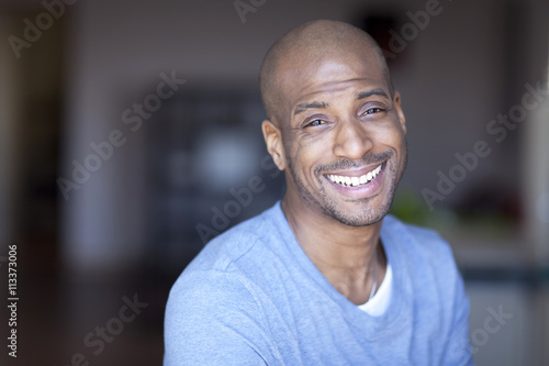 Portrait Of A Mature Black Man Smiling At Home