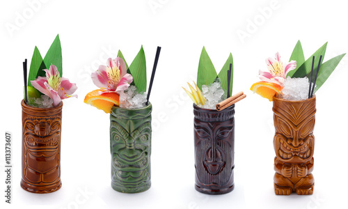 Tropical cocktails served in a tiki style glass and garnished with fruits