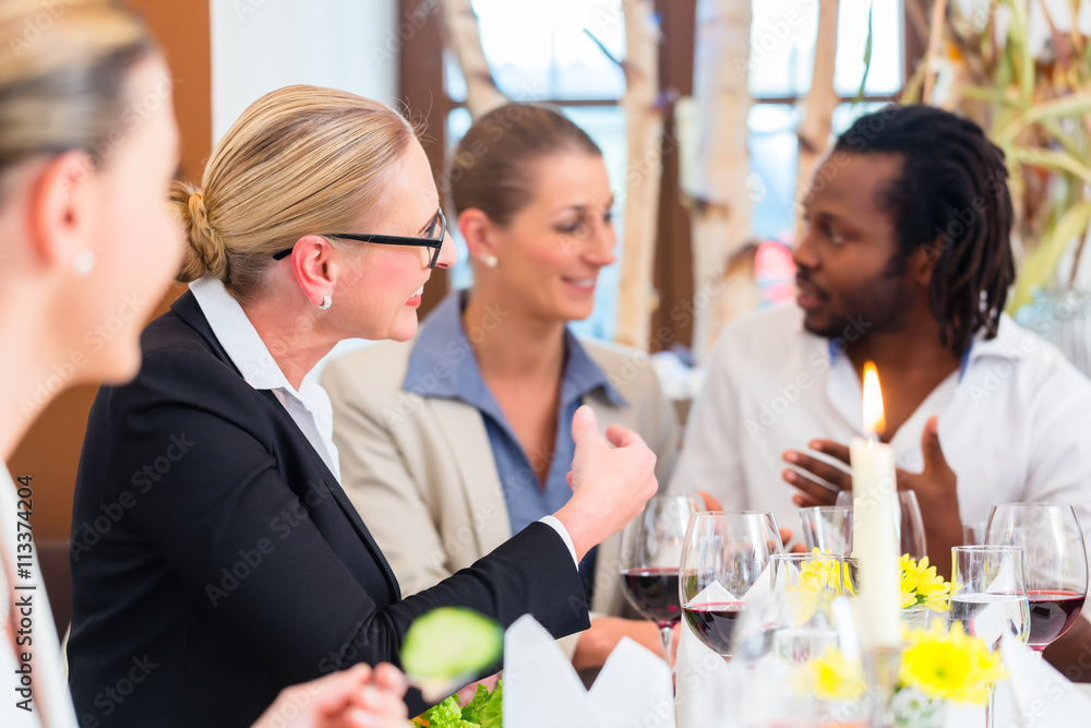 Business lunch in restaurant with food and wine Business lunch in restaurant with food and wine