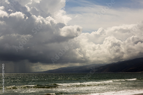 Pacific ocean during a storm. Beach landscape in the U.S. in bad weather. The ocean and waves during strong winds in United States, Santa Monica. 