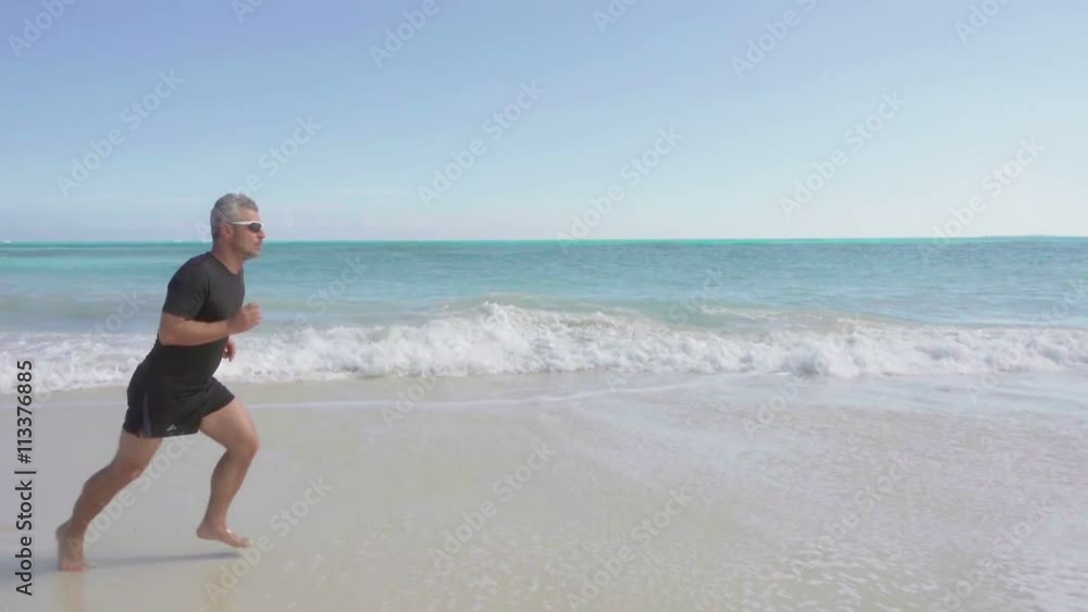 healthy lifestyle,fit man jogging by the sea slow motion steadicam healthy lifestyle,fit man jogging by the sea slow motion steadicam
