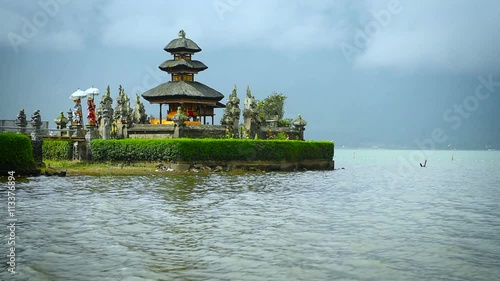 Temple Pura Ulun Danu Bratan, or Pura Bratan, is located on the shores of Lake Bratan in the mountains near Bedugul, is a major Shivaite and water temple of Bali, Indonesia. Full HD Video 1920x1080 photo