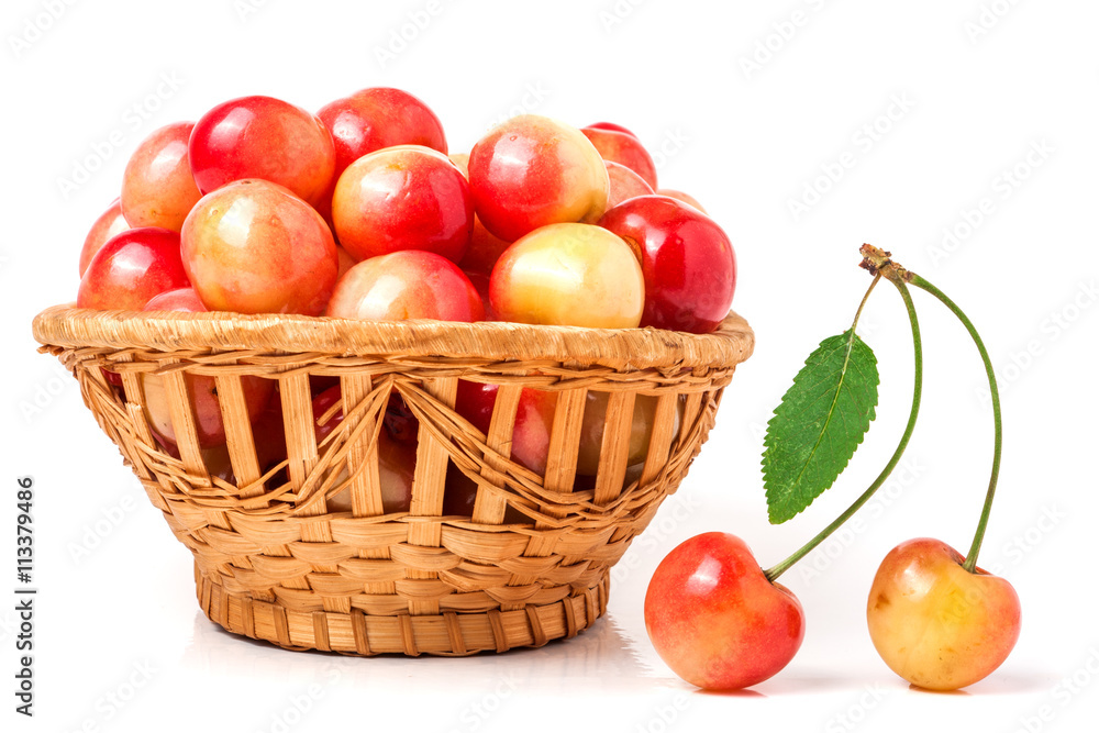 yellow cherries in a wicker basket isolated on white background yellow cherries in a wicker basket isolated on white background