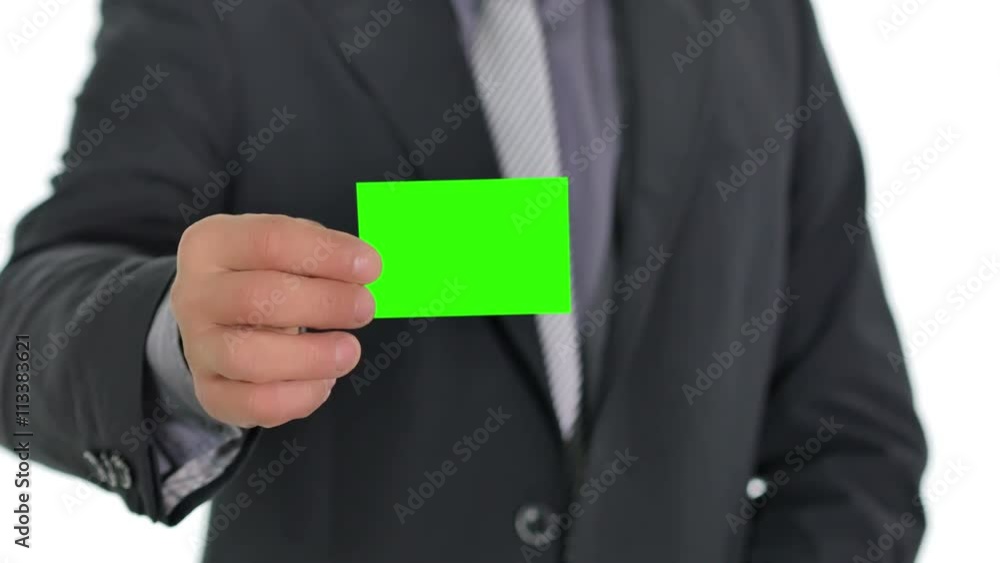 business man giving a green business card to the camera close up on hand business man giving a green business card to the camera close up on hand