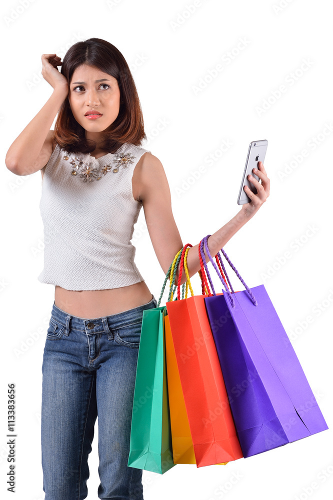 women with shopping bag and mobile phone on white background with clipping path women with shopping bag and mobile phone on white background with clipping path