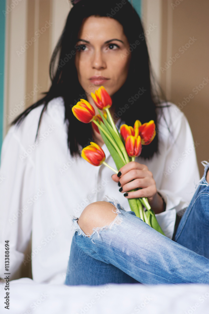 Black haired young woman in her bed in the morning Black haired young woman in her bed in the morning