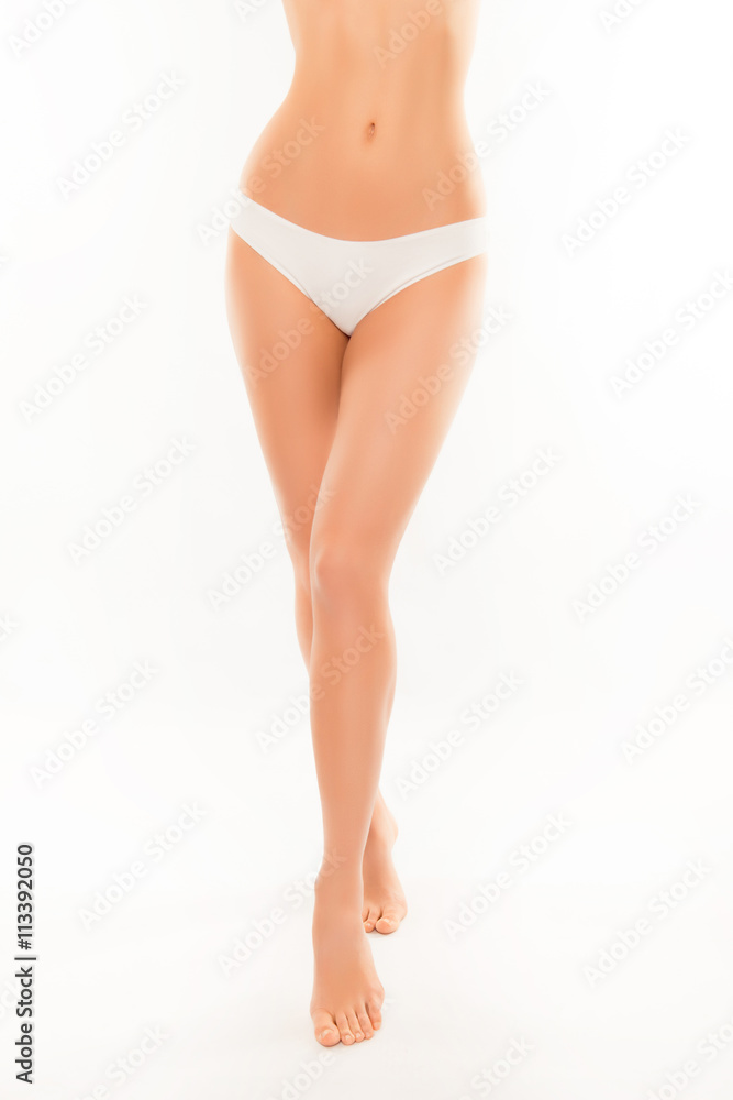Long smooth woman's legs and slim muscular belly