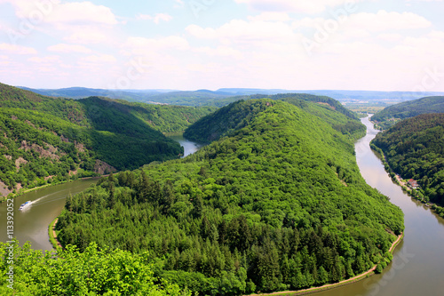 Saarschleife - The Saar river turning around the hill in Mettlach, Saarland, Germany. View of the Saar river bend from the vantage point Cloef. Beautiful trip destination on summer day.