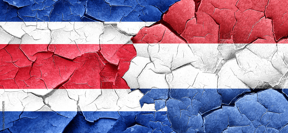 Costa Rica flag with Netherlands flag on a grunge cracked wall